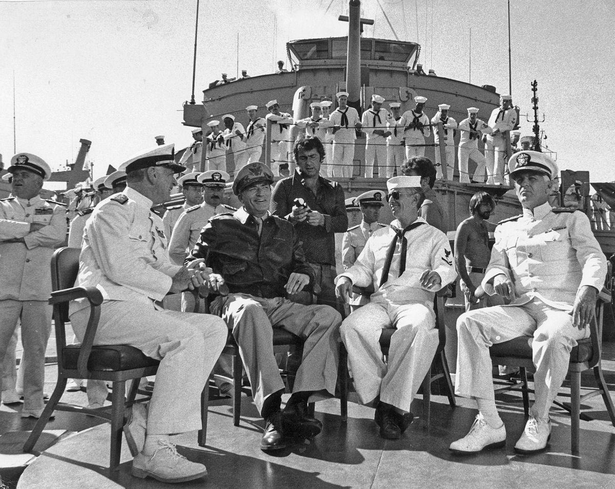 Tosi check his light on star Gregory Peck while filming the World War II biography, aboard the USS Missouri and shooting a sequence depicting the Japanese surrender that ended the conflict — where the actual event took place in 1945.