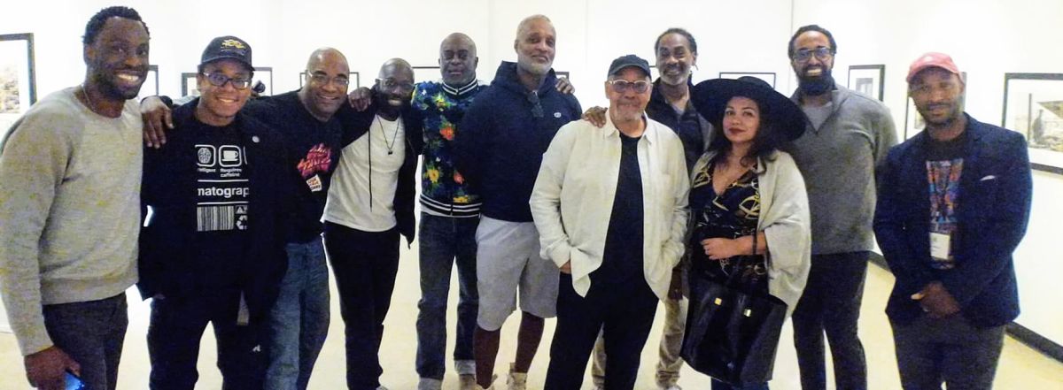 Simmons (in white jacket) with friends and guests at the museum, including cinematographer Hans Charles, camera operator and cinematographer Quenelle Jones, cinematographer Dennis Flippin, cinematographer Michelle Clementine, cinematographer Daniel Patterson, cinematographer Tommy Maddox-Upshaw and cinematographer Yves Wilson.